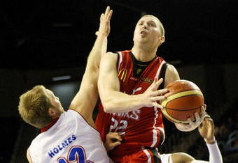 WOLLONGONG, AUSTRALIA - NOVEMBER 25: Tim Coenraad of the Hawks takes on the defence during the round 10 NBL match between the Wollongong Hawks and the Adelaide 36ers  at Wollongong Entertainment Centre on November 25, 2009 in Wollongong, Australia.  (Photo by Mark Nolan/Getty Images)