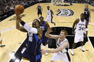 SAN ANTONIO - NOVEMBER 11:  Drew Gooden #90 of the Dallas Mavericks goes up for a shot against Matt Bonner #15 of the San Antonio Spurs during the game at AT&T Center on November 11, 2009 in San Antonio, Texas.  NOTE TO USER: User expressly acknowledges and agrees that, by downloading and or using this photograph, User is consenting to the terms and conditions of the Getty Images License Agreement. (Photo by Ronald Martinez/Getty Images)
