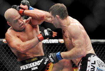 LAS VEGAS - NOVEMBER 21: Tito Ortiz (L) battles Forrest Griffin (R) during their Light Heavyweight Fight at the UFC 106 at Mandalay Bay Events Center on November 21, 2009 in Las Vegas, Nevada. (Photo by Jon Kopaloff/Getty Images)
