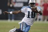 HOUSTON - NOVEMBER 23:  Quarterback Vince Young #10 of the Tennessee Titans scrambles for a first down in the fourth quarter against the Houston Texans at Reliant Stadium on November 23, 2009 in Houston, Texas. Tennessee won 20-17 on a Rob Bironas 53 yard field goal.
