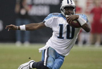 HOUSTON - NOVEMBER 23:  Quarterback Vince Young #10 of the Tennessee Titans scrambles for a first down in the fourth quarter against the Houston Texans at Reliant Stadium on November 23, 2009 in Houston, Texas. Tennessee won 20-17 on a Rob Bironas 53 yard field goal.