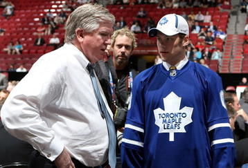 MONTREAL, QC - JUNE 27:  Kenny Ryan speaks to General Manager Brian Burke of the Toronto Maple Leafs organization after he was drafted by the Leafs in the second round during the 2009 NHL Entry Draft at the Bell Centre on June 27, 2009 in Montreal, Quebec, Canada. (Photo by Bruce Bennett/Getty Images) 