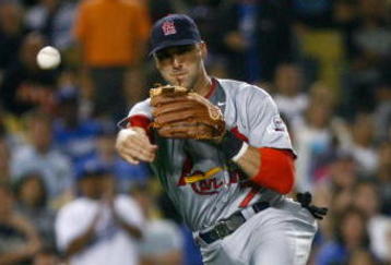 LOS ANGELES, CA - AUGUST 17:  Third baseman Mark DeRosa #7 of the St. Louis Cardinals throws Russelll Martin of the Los Angeles Dodgers out at first in the eighth inning at Dodger Stadium on August 17, 2009 in Los Angeles, California.  (Photo by Jeff Gross/Getty Images)