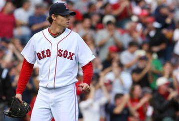BOSTON - OCTOBER 11:  Clay Buchholz #61 of the Boston Red Sox looks on from the mound in the second inning against the Los Angeles Angels of Anaheim in Game Three of the ALDS during the 2009 MLB Playoffs at Fenway Park on October 11, 2009 in Boston,  Massachusetts. (Photo by Jim Rogash/Getty Images)