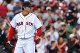 BOSTON - OCTOBER 11:  Clay Buchholz #61 of the Boston Red Sox looks on from the mound in the second inning against the Los Angeles Angels of Anaheim in Game Three of the ALDS during the 2009 MLB Playoffs at Fenway Park on October 11, 2009 in Boston,  Massachusetts. (Photo by Jim Rogash/Getty Images)