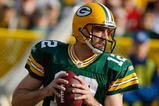 GREEN BAY, WI - NOVEMBER 22: Quarterback Aaron Rodgers #12 of the Green Bay Packers passes the football against the San Francisco 49ers at Lambeau Field on November 22, 2009 in Green Bay, Wisconsin. The Packers defeated the 49ers 30-24. (Photo by Scott Boehm/Getty Images)