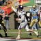 EL PASO, TX - DECEMBER 30:  Quarterback Brett Basanez #14 of the Northwestern Wildcats throws against the UCLA Bruins in the second quarter during the Vitalis Sun Bowl on December 30, 2005 at the Sun Bowl in El Paso, Texas. The Bruins defeated the Wildcats 50-38.  (Photo by Brian Bahr/Getty Images)