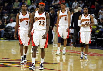 OAKLAND, CA - NOVEMBER 06:  Kelenna Azubuike #7, Anthony Morrow #22, Anthony Randolph #4 and C.J. Watson #23 of the Golden State Warriors walk back on to the court after a time out late in their loss to the Los Angeles Clippers at Oracle Arena on November 6, 2009 in Oakland, California. NOTE TO USER: User expressly acknowledges and agrees that, by downloading and/or using this Photograph, User is consenting to the terms and conditions of the Getty Images License Agreement.  (Photo by Ezra Shaw/Getty Images)