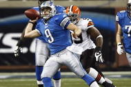 DETROIT, MI - NOVEMBER 22: Matthew Stafford #9 of the Detroit Lions passes the football while under pressure against the Cleveland Browns at Ford Field on November 22, 2009 in Detroit, Michigan. The Lions came from behind to defeat the Browns 38-37. (Photo by Joe Robbins/Getty Images)