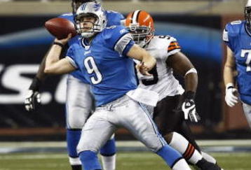 DETROIT, MI - NOVEMBER 22: Matthew Stafford #9 of the Detroit Lions passes the football while under pressure against the Cleveland Browns at Ford Field on November 22, 2009 in Detroit, Michigan. The Lions came from behind to defeat the Browns 38-37. (Photo by Joe Robbins/Getty Images)