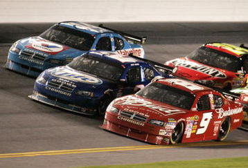 DAYTONA BEACH, FL - FEBRUARY 07:  AJ Allmendinger, driver of the #10 Valvoline Dodge, races along side Kurt Busch, driver of the #2 Miller Lite Dodge, and Kasey Kahne, driver of the #9 Budweiser Dodge, during the NASCAR Sprint Cup Series Budweiser Shootout at Daytona International Speedway on February 7, 2009 in Daytona Beach, Florida.  (Photo by Jerry Markland/Getty Images for NASCAR)