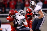 SALT LAKE CITY - NOVEMBER 22:  Max Hall #15 of the BYU Cougarsis sacked by Tatum Drecksel #47 of  the Utah Utes at Rice-Eccles Stadium on November 22, 2008 in Salt Lake City, Utah.  (Photo by Jonathan Ferrey/Getty Images)