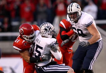 SALT LAKE CITY - NOVEMBER 22:  Max Hall #15 of the BYU Cougarsis sacked by Tatum Drecksel #47 of  the Utah Utes at Rice-Eccles Stadium on November 22, 2008 in Salt Lake City, Utah.  (Photo by Jonathan Ferrey/Getty Images)