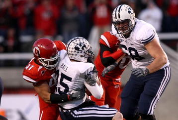 SALT LAKE CITY - NOVEMBER 22:  Max Hall #15 of the BYU Cougarsis sacked by Tatum Drecksel #47 of  the Utah Utes at Rice-Eccles Stadium on November 22, 2008 in Salt Lake City, Utah.  (Photo by Jonathan Ferrey/Getty Images)