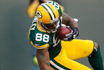 GREEN BAY, WI - NOVEMBER 22: Tight end Jermichael Finley #88 of the Green Bay Packers dives for additional yardage after a pass reception against the San Francisco 49ers at Lambeau Field on November 22, 2009 in Green Bay, Wisconsin. The Packers defeated the 49ers 30-24. (Photo by Scott Boehm/Getty Images)