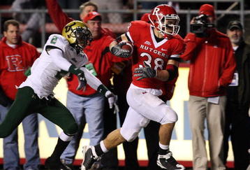 PISCATAWAY, NJ - NOVEMBER 12:  Joe Martinek #38 of the Rutgers Scarlet Knights runs the ball past Quenton Washington #2 of the South Florida Bulls for a fourth quarter touchdown at Rutgers Stadium on November 12, 2009 in Piscataway, New Jersey. Rutgers won the game 31-0.  (Photo by Jim McIsaac/Getty Images)