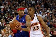 OAKLAND, CA - NOVEMBER 13:  Allen Iverson #1 of the Detroit Pistons drives to the basket past C.J. Watson #23 of the Golden State Warriors during the game on November 13, 2008 at Oracle Arena in Oakland, California.  The Piston won 107-102.  NOTE TO USER: User expressly acknowledges and agrees that, by downloading and or using this photograph, User is consenting to the terms and conditions of the Getty Images License Agreement. (Photo by Jed Jacobsohn/Getty Images)