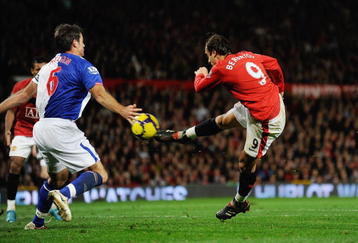 MANCHESTER, ENGLAND - OCTOBER 31: Dimitar Berbatov of Manchester United scores the first goal  during the Barclays Premier League match between Manchester United and Blackburn Rovers at Old Trafford on October 31, 2009 in Manchester, England.  (Photo by Michael Regan/Manchester United)