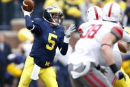 ANN ARBOR, MI - NOVEMBER 21: Tate Forcier #5 of the Michigan Wolverines throws a first quarter pass while playing the Ohio State Buckeyes on November 21, 2009 at Michigan Stadium in Ann Arbor, Michigan.  (Photo by Gregory Shamus/Getty Images)