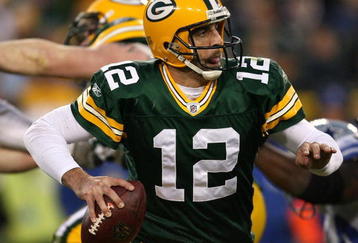GREEN BAY, WI - NOVEMBER 15: Aaron Rodgers #12 of the Green Bay Packers looks for a receiver against the Dallas Cowboys at Lambeau Field on November 15, 2009 in Green Bay, Wisconsin. The Packers defeated the Cowboys 17-7. (Photo by Jonathan Daniel/Getty Images)
