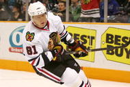 SAN JOSE, CA - NOVEMBER 25:  A Blackhawks fan celebrates in the background after Marian Hossa #81 of the Chicago Blackhawks scored a shorthanded goal against the San Jose Sharks during their game at HP Pavilion on November 25, 2009 in San Jose, California.  (Photo by Ezra Shaw/Getty Images)