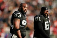 OAKLAND, CA - NOVEMBER 22:  Tommy Kelly #93 and Gerard Warren #61 of the Oakland Raiders react after the Cincinnati Bengals scored a touchdown at Oakland-Alameda County Coliseum on November 22, 2009 in Oakland, California.  (Photo by Ezra Shaw/Getty Images)