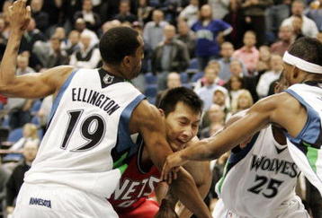 MINNEAPOLIS, MN - OCTOBER 28: Yi Jianlian #9 of the New Jersey Nets gets triple-teamed by Wayne Ellington #19 of the Minnesota Timberwolves and teammates Al Jefferson #25 and Corey Brewer #22 in the fourth quarter at the Target Center on October 28, 2009 in Minneapolis, Minnesota. The Timberwolves defeated the Nets 95-93. (Photo by Genevieve Ross/Getty Images)