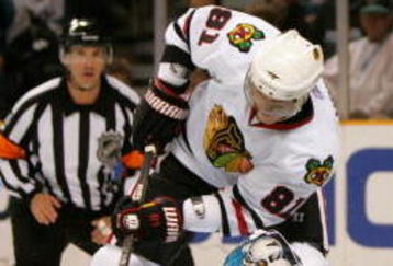 SAN JOSE, CA - NOVEMBER 25:  Marian Hossa #81 of the Chicago Blackhawks is stopped by goalie Evgeni Nabokov #20 of the San Jose Sharks during their game at HP Pavilion on November 25, 2009 in San Jose, California.  (Photo by Ezra Shaw/Getty Images)
