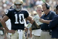 SOUTH BEND, IN - SEPTEMBER 9: Brady Quinn #10 of the Notre Dame Fighting Irish talks with head coach Charlie Weis during a game against the Penn State Nittany Lions on September 9, 2006 at Notre Dame Stadium in South Bend, Indiana. Notre Dame won the game 41-17. (Photo By Gregory Shamus/Getty Images)