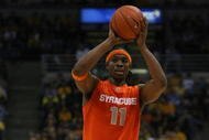 MILWAUKEE - MARCH 07: Paul Harris #11 of the Syracuse Orange looks to pass against the Marquette Golden Eagles on March 7, 2009 at the Bradley Center in Milwaukee, Wisconsin. Syracuse defeated Marquette 86-79 in overtime. (Photo by Jonathan Daniel/Getty Images)
