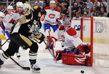 PITTSBURGH - NOVEMBER 25:  Ruslan Fedotenko #26 of the Pittsburgh Penguins loses control of the puck as he moves in on goaltender Carey Price #31 of the Montreal Canadiens on November 25, 2009 at Mellon Arena in Pittsburgh, Pennsylvania.  (Photo by Jamie Sabau/Getty Images)