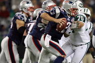 FOXBORO, MA - NOVEMBER 22:  Tom Brady #12 of the New England Patriots scrambles as Mike DeVito #70 of the New York Jets pressures on November 22, 2009 at Gillette Stadium in Foxboro, Massachusetts. The Patriots defeated the Jets 31-14.  (Photo by Elsa/Getty Images)