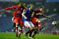 GLASGOW, SCOTLAND - SEPTEMBER 29:  David Weir of Rangers tackles Luis Fabiano and Adriano of Sevilla during the UEFA Champions League Group G match between Rangers and Sevilla at Ibrox Stadium on September 29, 2009 in Glasgow, Scotland.  (Photo by Jeff J Mitchell/Getty Images)