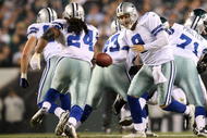 PHILADELPHIA - NOVEMBER 08: Tony Romo #9 of the Dallas Cowboys hands the ball off to Marion Barber #24 against the Philadelphia Eagles at Lincoln Financial Field on November 8, 2009 in Philadelphia, Pennsylvania. (Photo by Al Bello/Getty Images)