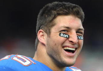 GAINESVILLE, FL - NOVEMBER 21: Quarterback Tim Tebow #15 of the Florida Gators watches fourth-quarter play against the Florida International University Golden Panthers, November 21, 2009 at Ben Hill Griffin Stadium in Gainesville, Florida.  (Photo by Al Messerschmidt/Getty Images)
