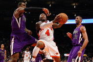 NEW YORK - MARCH 20: Nate Robinson #4 of the New York Knicks lays the ball up against Donte Greene #20 of the Sacramento Kingson March 20, 2009 at Madison Square Garden in New York City. NOTE TO USER: User expressly acknowledges and agrees that, by downloading and or using this photograph, User is consenting to the terms and conditions of the Getty Images License Agreement. (Photo by Nick Laham/Getty Images)