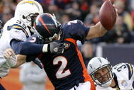 DENVER - NOVEMBER 22:  Quarterback Chris Simms #2 of the Denver Broncos is sacked by Kevin Burnett #99 and Eric Weddle #32 of the San Diego Chargers during NFL action at Invesco Field at Mile High on November 22, 2009 in Denver, Colorado.  (Photo by Doug Pensinger/Getty Images)