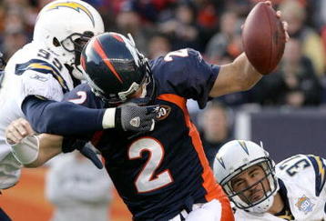DENVER - NOVEMBER 22:  Quarterback Chris Simms #2 of the Denver Broncos is sacked by Kevin Burnett #99 and Eric Weddle #32 of the San Diego Chargers during NFL action at Invesco Field at Mile High on November 22, 2009 in Denver, Colorado.  (Photo by Doug Pensinger/Getty Images)
