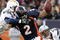 DENVER - NOVEMBER 22:  Quarterback Chris Simms #2 of the Denver Broncos is sacked by Kevin Burnett #99 and Eric Weddle #32 of the San Diego Chargers during NFL action at Invesco Field at Mile High on November 22, 2009 in Denver, Colorado.  (Photo by Doug Pensinger/Getty Images)