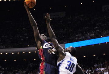ORLANDO, FL - NOVEMBER 11:  J.J. Hickson #21 of the Cleveland Cavaliers puts up a shot under pressure over Brandon Bass #30 of the Orlando Magic during the game on November 11, 2009 at Amway Arena in Orlando, Florida. NOTE TO USER: User expressly acknowledges and agrees that, by downloading and/or using this Photograph, user is consenting to the terms and conditions of the Getty Images License Agreement. (Photo by Sam Greenwood/Getty Images)