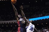 ORLANDO, FL - NOVEMBER 11:  J.J. Hickson #21 of the Cleveland Cavaliers puts up a shot under pressure over Brandon Bass #30 of the Orlando Magic during the game on November 11, 2009 at Amway Arena in Orlando, Florida. NOTE TO USER: User expressly acknowledges and agrees that, by downloading and/or using this Photograph, user is consenting to the terms and conditions of the Getty Images License Agreement. (Photo by Sam Greenwood/Getty Images)