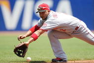 SAN FRANCISCO - AUGUST 9:  Alex Gonzalez of the Cincinnati Reds can't make a play on a single hit by Aaron Rowand #33 of the San Francisco Giants in the bottom of the second inning at AT&T Park  on August 9, 2009 in San Francisco, California.  (Photo by Jed Jacobsohn/Getty Images)