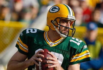 GREEN BAY, WI - NOVEMBER 22: Quarterback Aaron Rodgers #12 of the Green Bay Packers passes the football against the San Francisco 49ers at Lambeau Field on November 22, 2009 in Green Bay, Wisconsin. The Packers defeated the 49ers 30-24. (Photo by Scott Boehm/Getty Images)