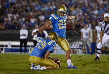 PASADENA, CA - SEPTEMBER 19:  Kai Forbath #25 of the UCLA Bruins kicks as Danny Rees #39 holds against the Kansas State Wildcats at the Rose Bowl on September 19, 2009 in Pasadena, California. UCLA defeated Kansas State 23-9.  (Photo by Jeff Gross/Getty Images)