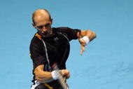 LONDON, ENGLAND - NOVEMBER 25:  Nikolay Davydenko of Russia returns the ball during the men's singles first round match against Rafael Nadal of Spain during the Barclays ATP World Tour Finals at the O2 Arena on November 25, 2009 in London, England.  (Photo by Matthew Lewis/Getty Images for Barclays ATP Finals)