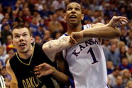 LAWRENCE, KS - NOVEMBER 25: Xavier Henry #1 of the Kansas Jayhawks competes for a rebound against Will Hudson #11 of the Oakland Golden Grizzlies during the game on November 25, 2009 at Allen Fieldhouse in Lawrence, Kansas. (Photo by Jamie Squire/Getty Images)