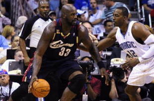 ORLANDO, FL - NOVEMBER 11: Shaquille O'Neal #33 of the Cleveland Cavaliers looks to maneuver against Dwight Howard #12 of the Orlando Magic during the game on November 11, 2009 at Amway Arena in Orlando, Florida. NOTE TO USER: User expressly acknowledges and agrees that, by downloading and/or using this Photograph, user is consenting to the terms and conditions of the Getty Images License Agreement. (Photo by Sam Greenwood/Getty Images)