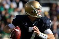 SOUTH BEND, IN - OCTOBER 17: Jimmy Clausen #7 of the Notre Dame Fighting Irish looks for a receiver against the USC Trojans at Notre Dame Stadium on October 17, 2009 in South Bend, Indiana. USC defeated Notre Dame 34-27. (Photo by Jonathan Daniel/Getty Images)