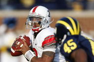 ANN ARBOR, MI - NOVEMBER 21: Terrelle Pryor #2 of the Ohio State Buckeyes looks to throw a fourth quarter pass behind Obi Ezeh #45 of the Michigan Wolverines on November 21, 2009 at Michigan Stadium in Ann Arbor, Michigan. Ohio State won the game 21-10. (Photo by Gregory Shamus/Getty Images)
