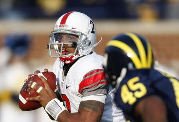 ANN ARBOR, MI - NOVEMBER 21:  Terrelle Pryor #2 of the Ohio State Buckeyes looks to throw a fourth quarter pass behind Obi Ezeh #45 of the Michigan Wolverines on November 21, 2009 at Michigan Stadium in Ann Arbor, Michigan. Ohio State won the game 21-10. (Photo by Gregory Shamus/Getty Images)